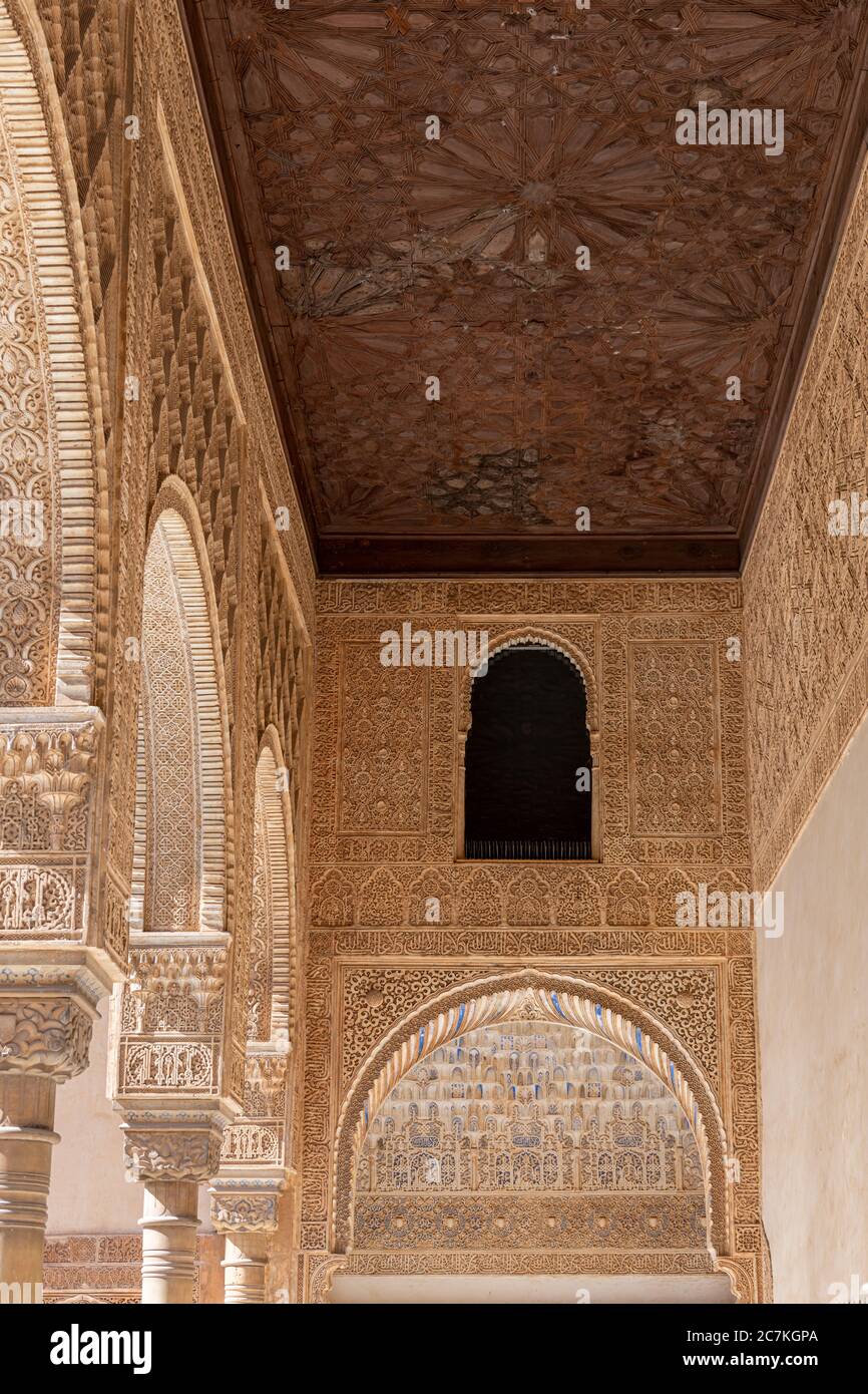 The North Gallery of the Comares Palace complex is intricately decorated with arabesque motifs and a polychrome muqarnas vault Stock Photo
