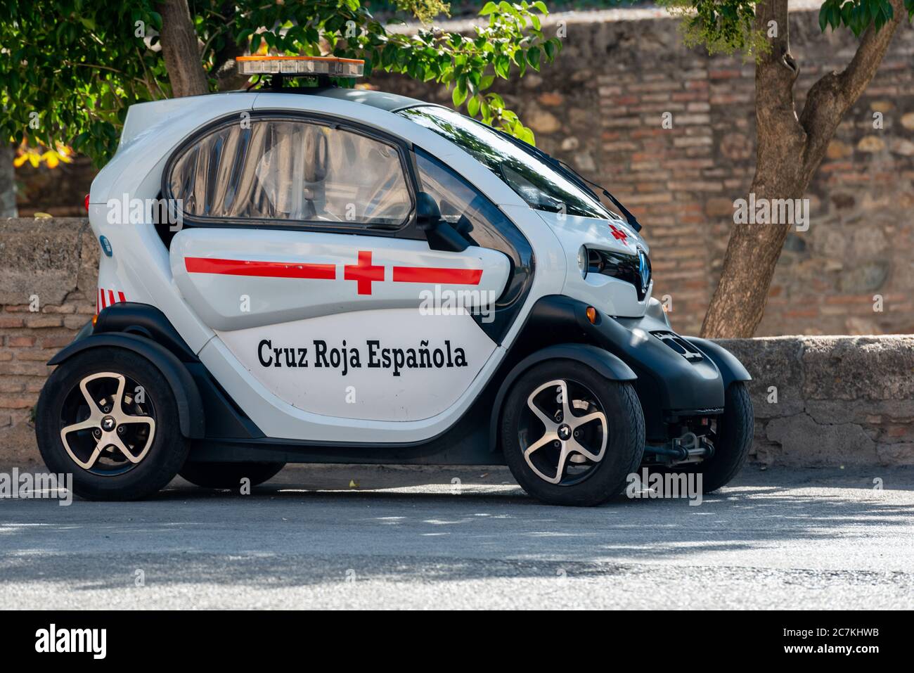 A Spanish Red Cross Renault TWIZY electric car in the Alhambra in