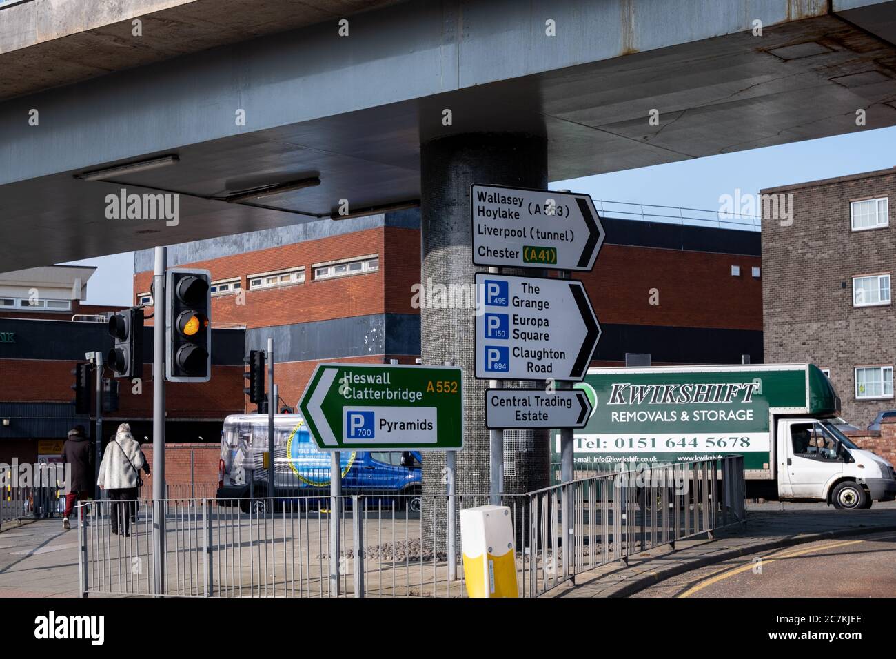 Multiple road signs at a roundabout inBirkenhead Wirral March 2020 Stock Photo