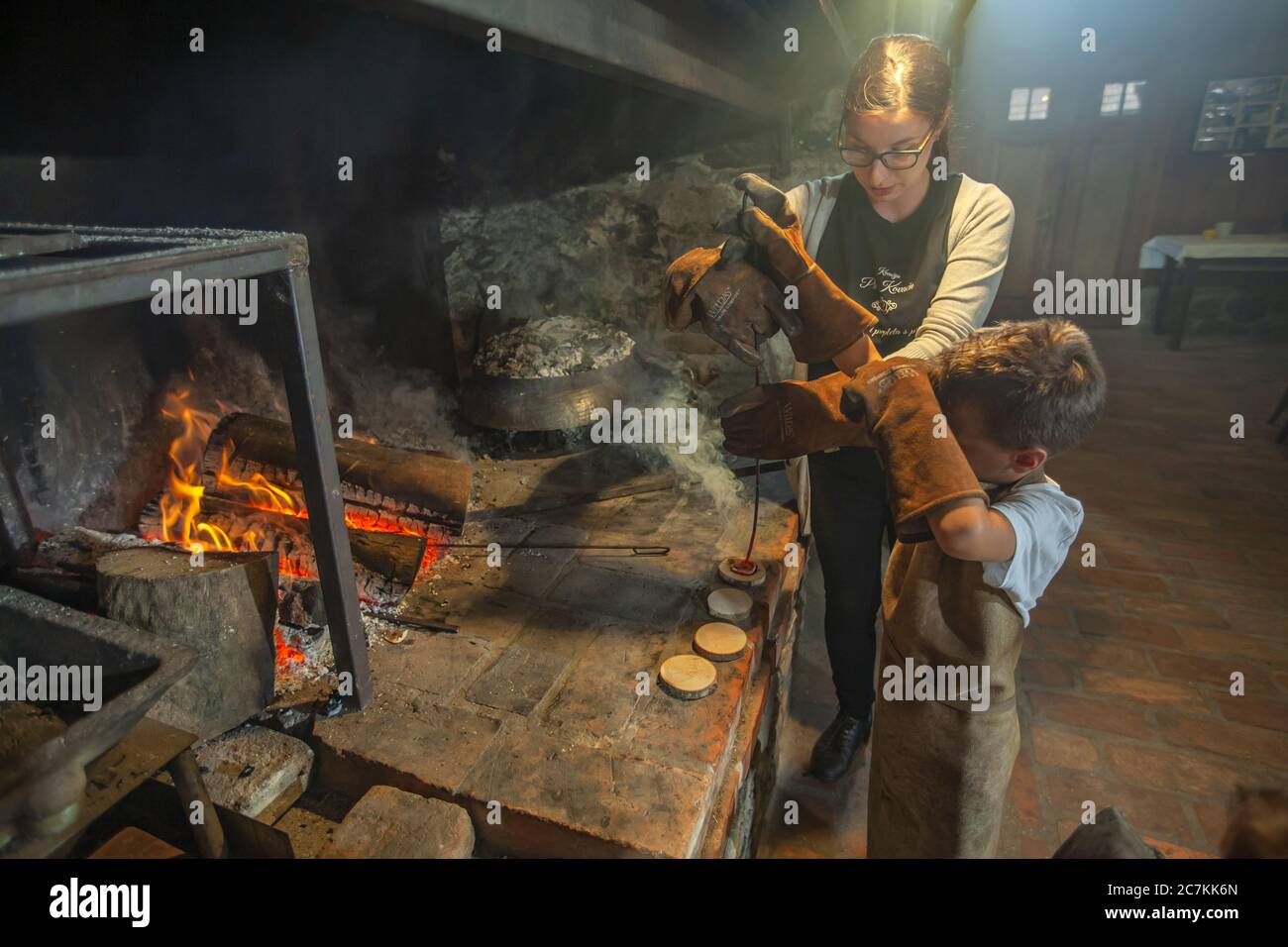 Beautiful shot of the young boy forging initials of his names with the help of a girl in Slovenia Stock Photo