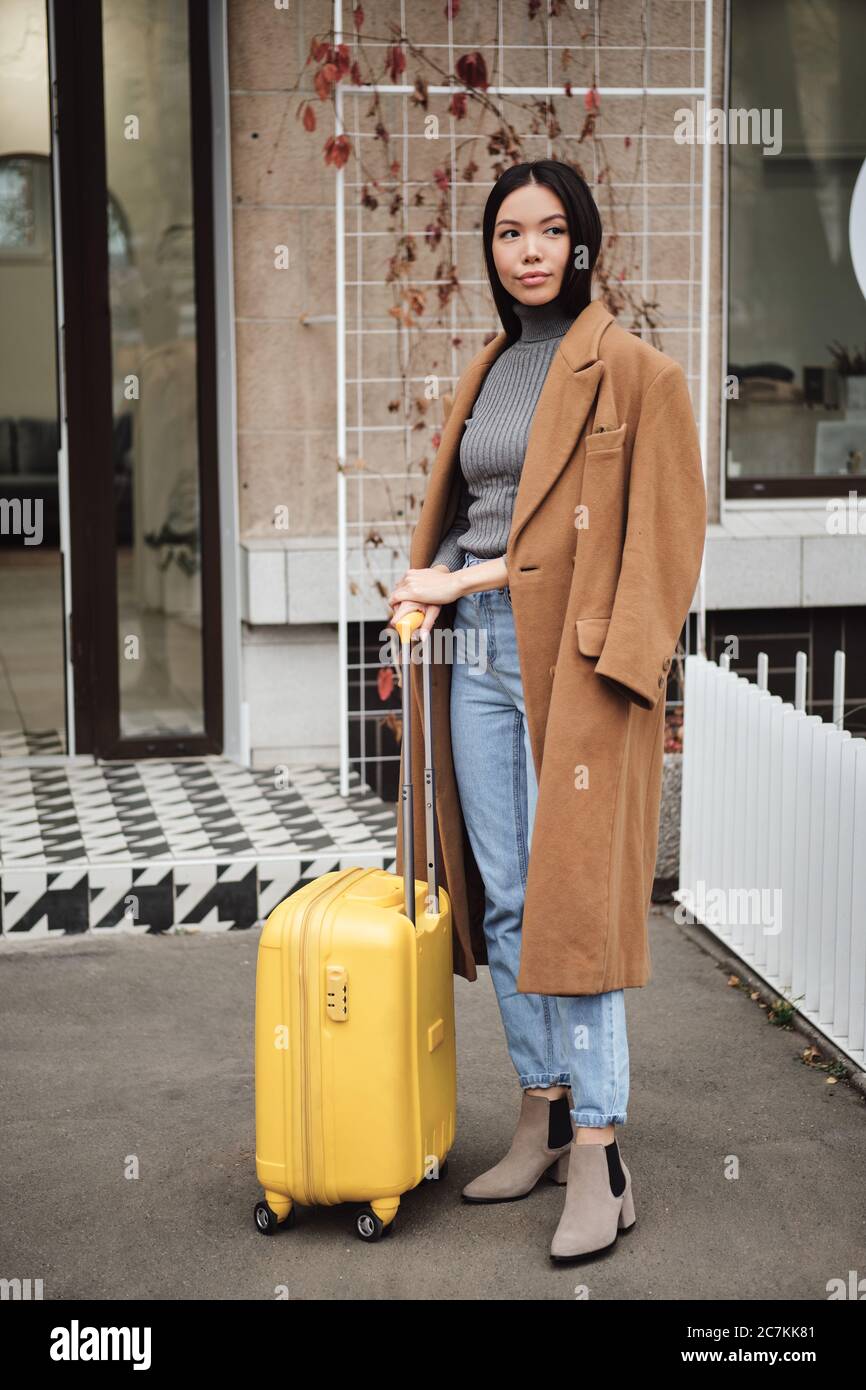 away suitcase yellow
