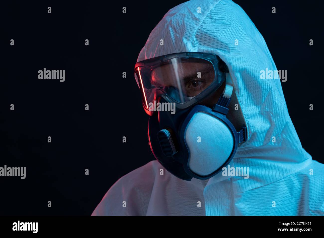 Symbol, corona, science, research, vaccine, danger, dystopian, protective suit,, side view Stock Photo