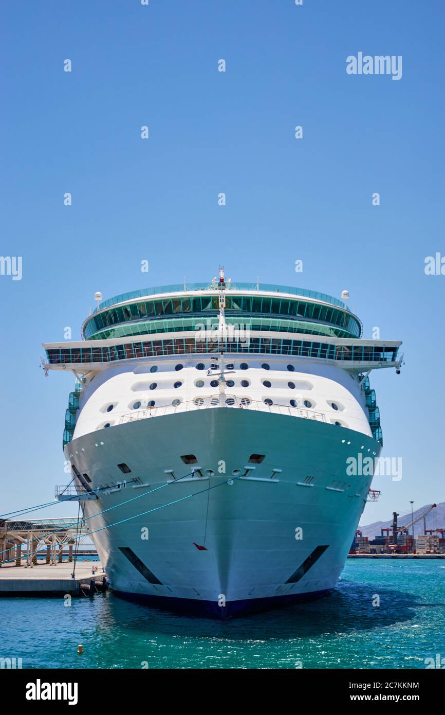 Front view of royal caribbean cruise ship independence of the seas docked at malaga on a bright sunny cloudless day with a gorgeous blue sky Stock Photo