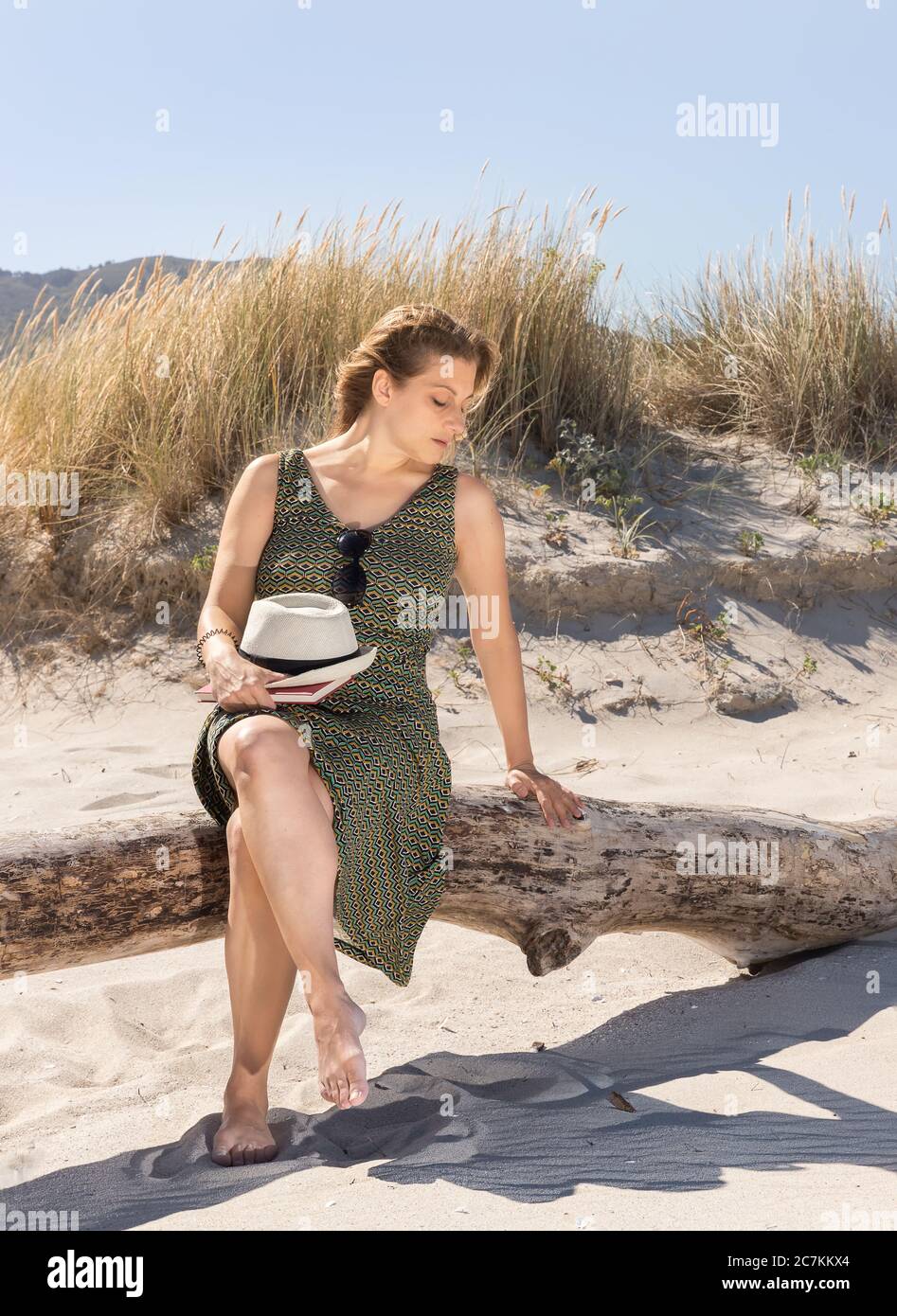 Mature woman sunbathing beach hi-res stock photography and images - Alamy