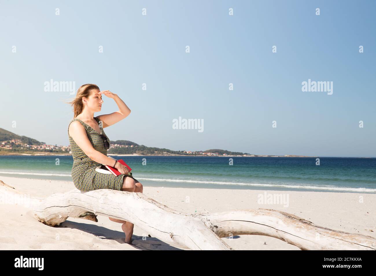 Mature woman sunbathing beach hi-res stock photography and images - Alamy