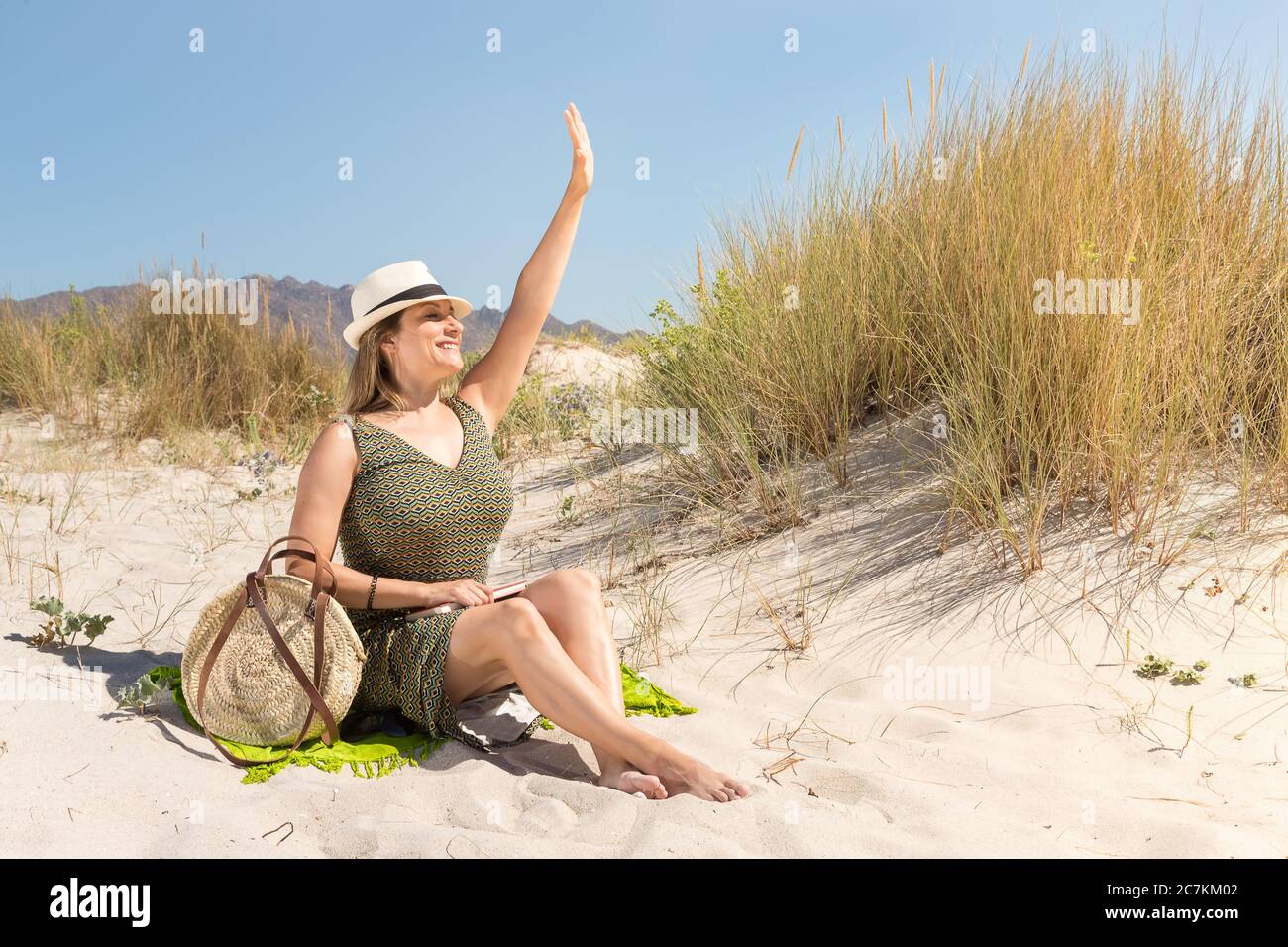 Mature woman sunbathing beach hi-res stock photography and images - Alamy
