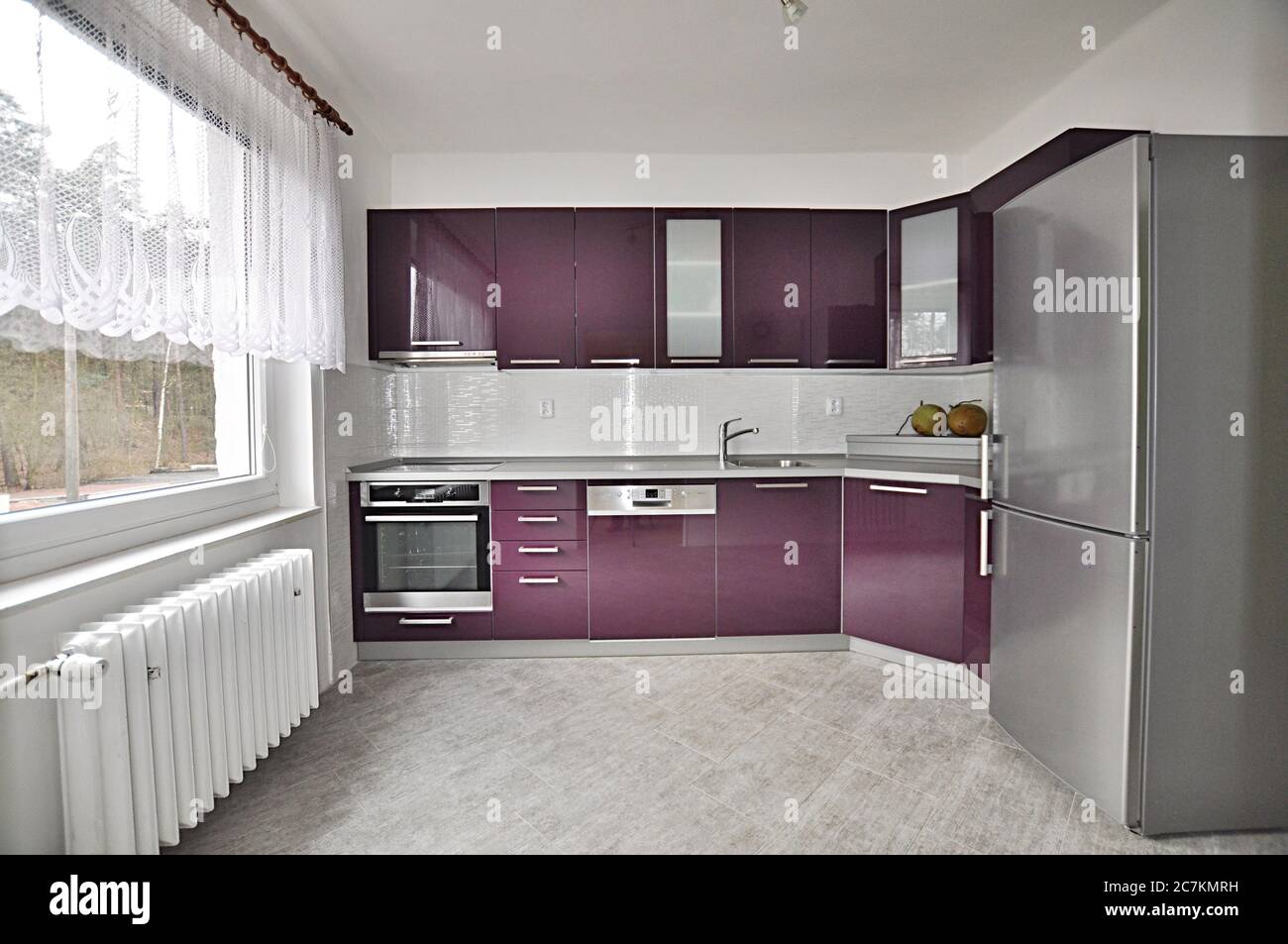 View of modern kitchen with purple elements Stock Photo - Alamy