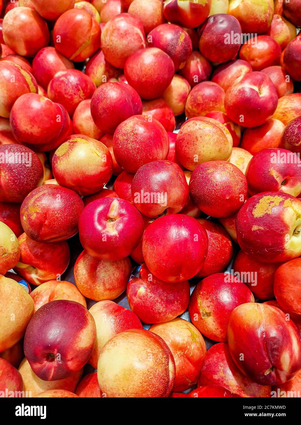 Vertical shot of fresh nectarines in the market Stock Photo