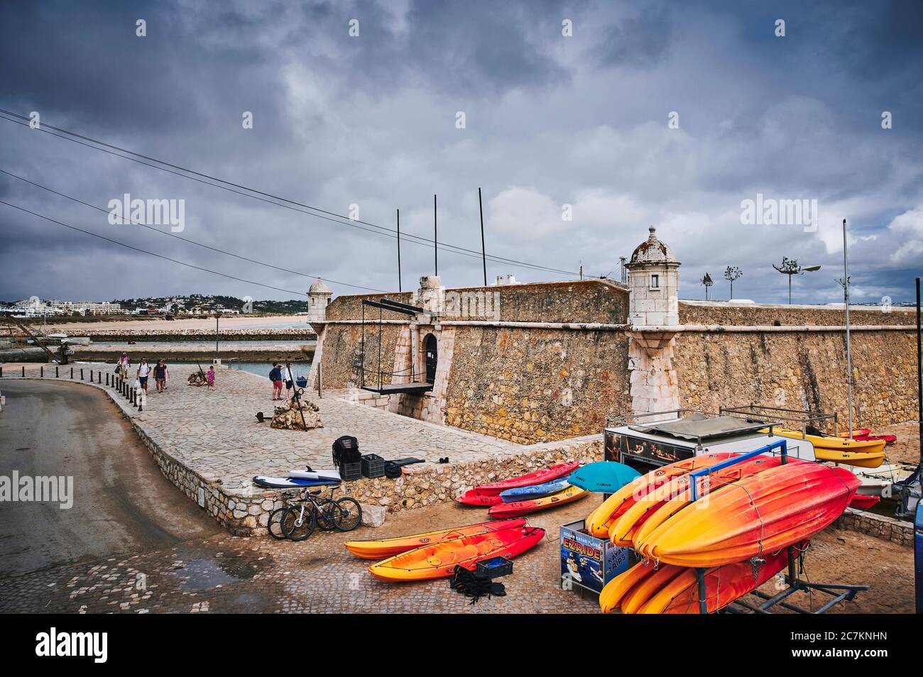 Europe, Portugal, Algarve, Litoral, Barlavento, Felsalgarve, District Faro, Lagos, Forte Ponta da Bandeira, with colorful kayaks in the foreground Stock Photo