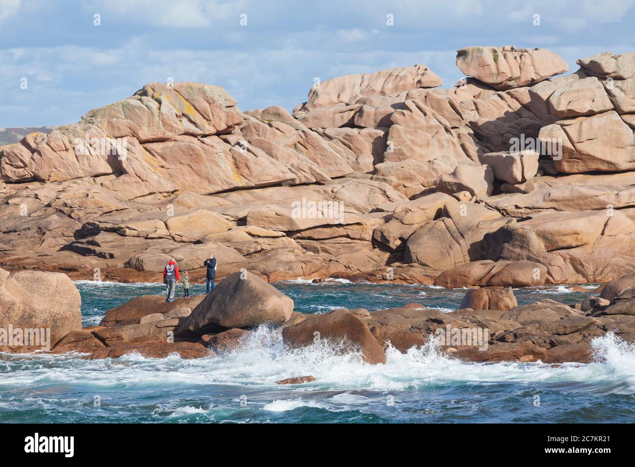 Cote de Granit Rose Rocks with people Stock Photo