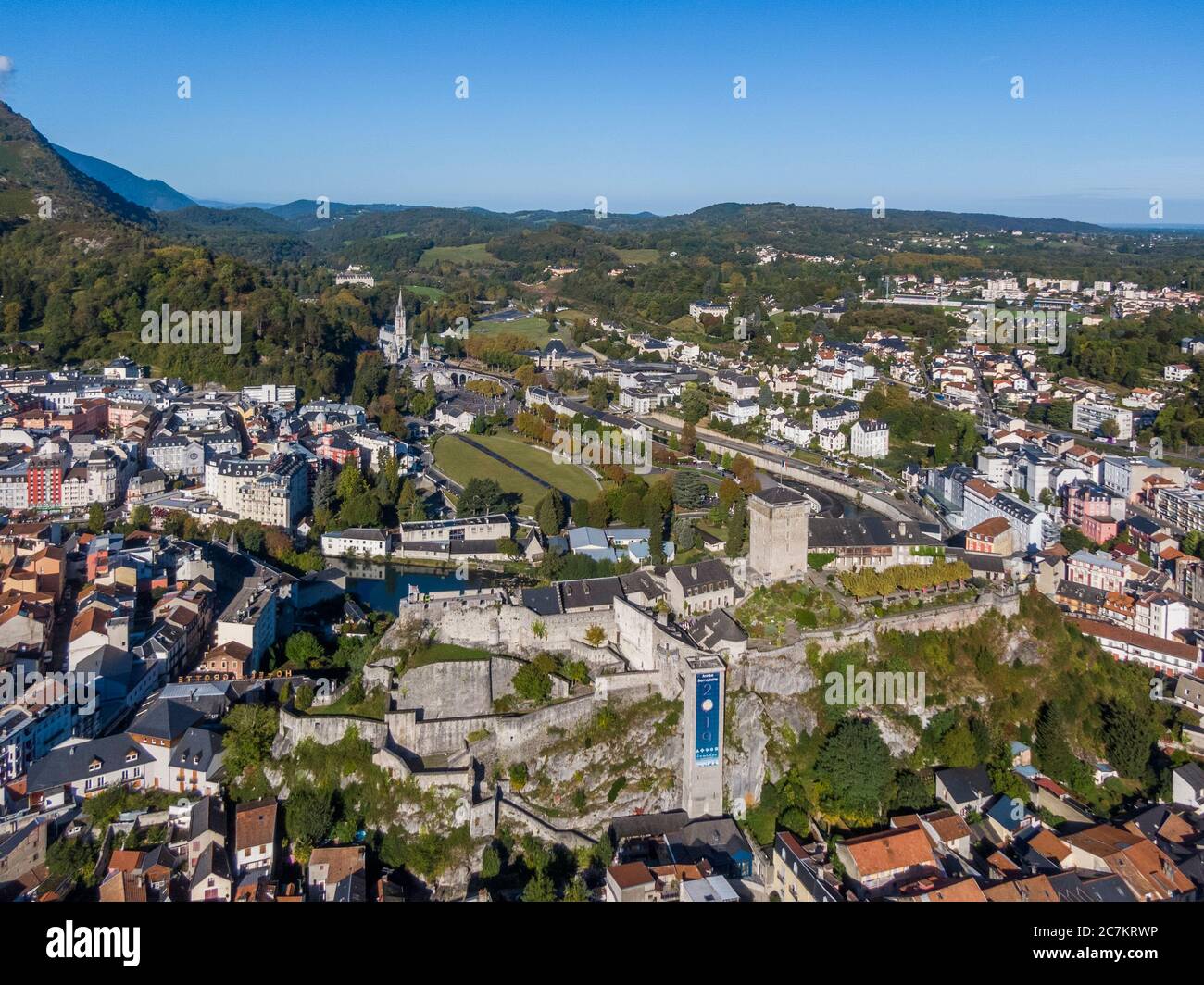 Aerial view of Sanctuary of Our Lady of Lourdes and Chateau fort de Lourdes, France Stock Photo
