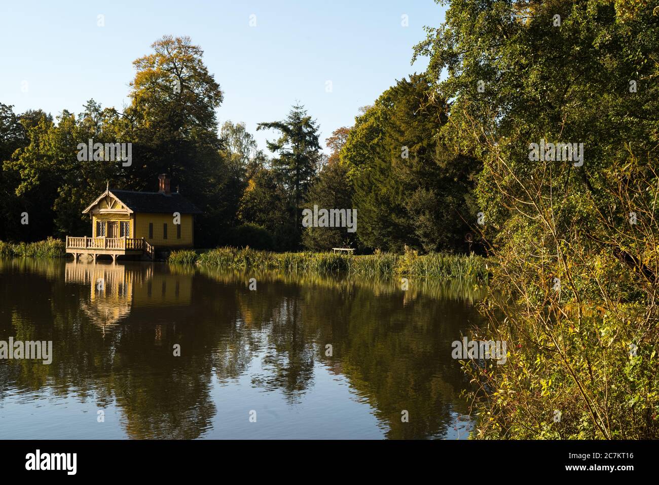 Belton House in Autumn, Grantham.The Boathouse on the lake. Stock Photo