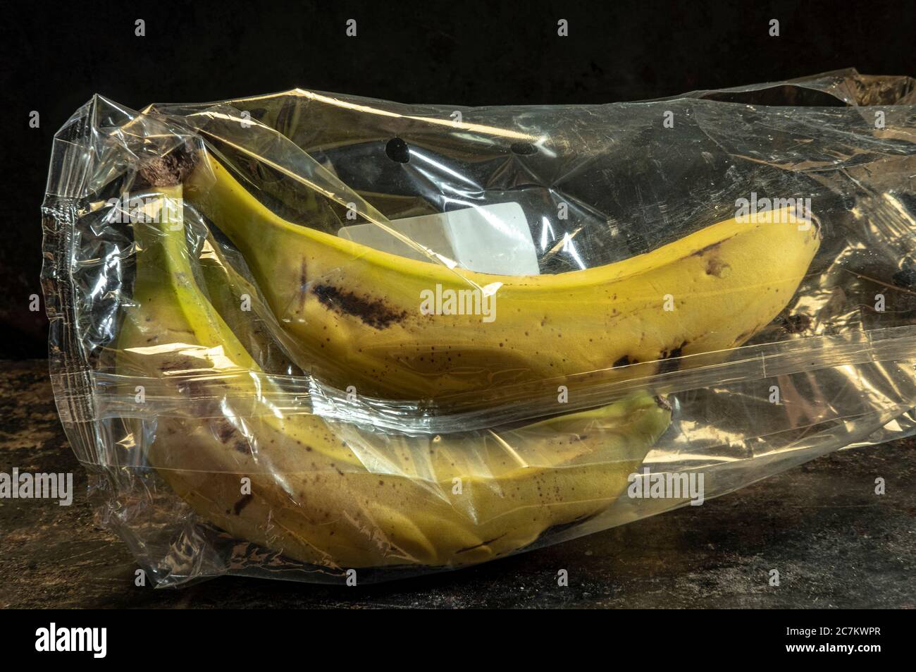 banana packed in non-biodegradable plastics Stock Photo