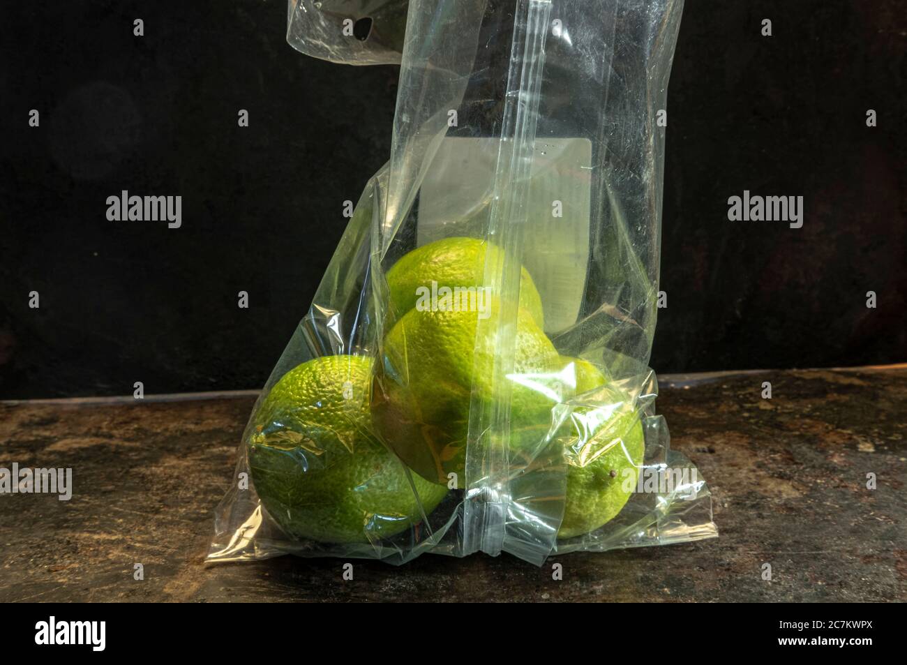lemons packed in non-biodegradable plastics Stock Photo