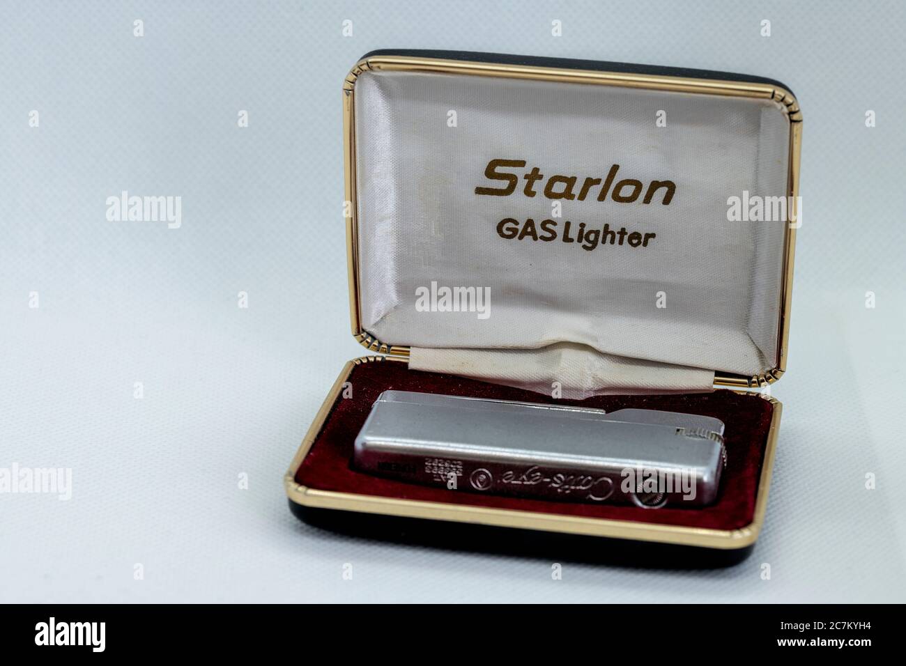 Retro refillable lighter in its case from the 70s Stock Photo