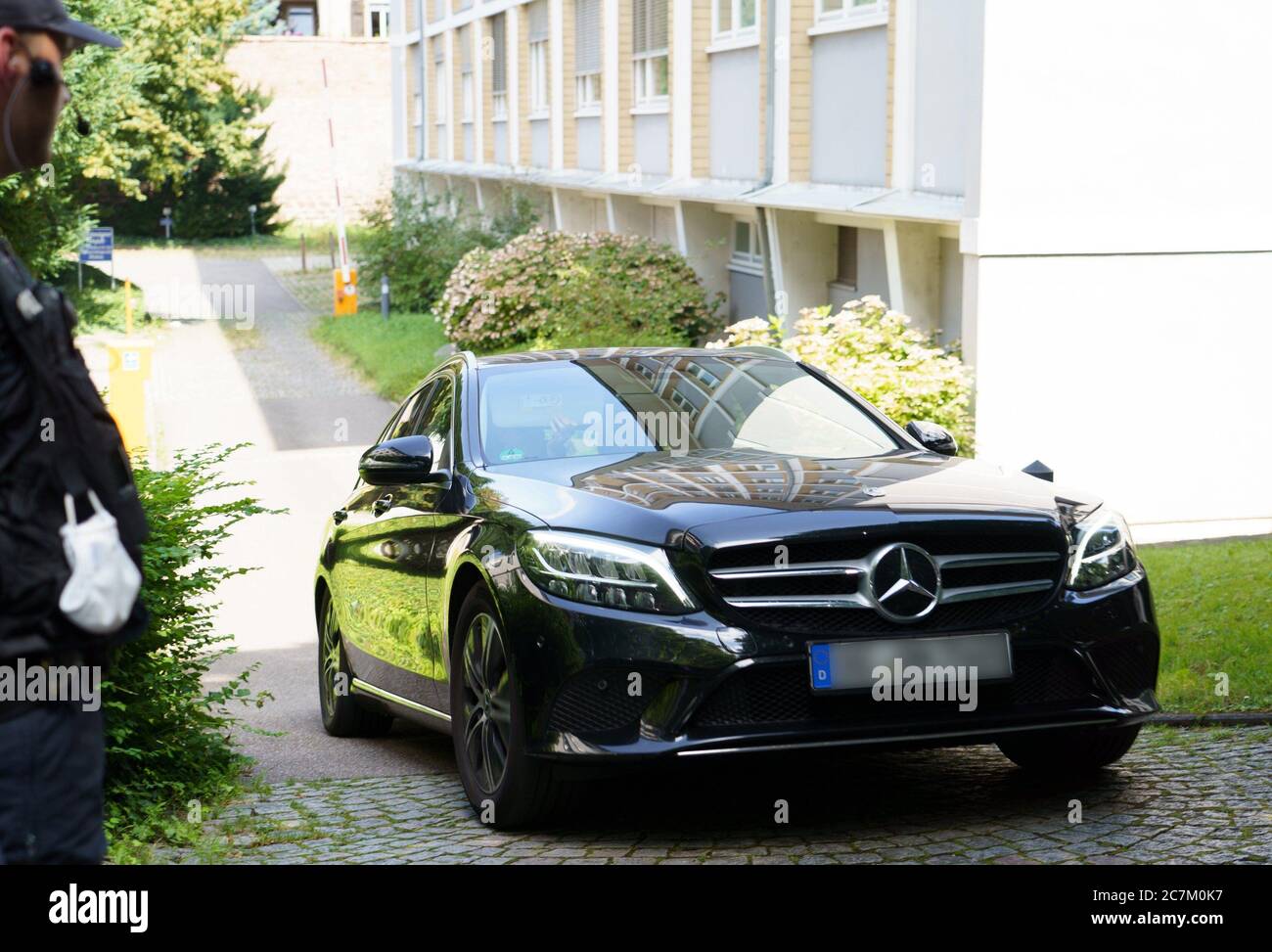 Offenburg, Germany. 18th Sep, 2019. The 31-year-old from the Black Forest town of Oppenau, who has been wanted for days, is transferred from the premises of the public prosecutor's office to a prison. He is accused of particularly severe predatory extortion. During an inspection in a garden shed illegally used by him, he had threatened four police officers and taken their service weapons. Afterwards he disappeared in the forest and could only be arrested on 17.07.2020. Credit: Benedikt Spether/dpa - ATTENTION: License plate was pixelated for legal reasons/dpa/Alamy Live News Stock Photo