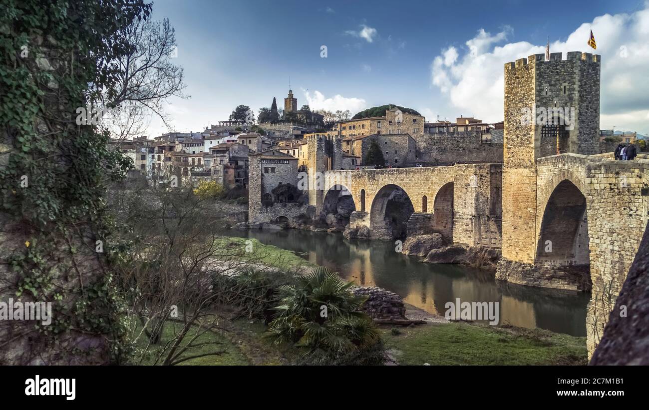 Pont Vell over the Fluvià river in Besalú. The place has been recognized as a cultural asset (Bien de Interés Cultural) in the Conjunto histórico-artístico category since 1966. The bridge was built around 1315. Stock Photo