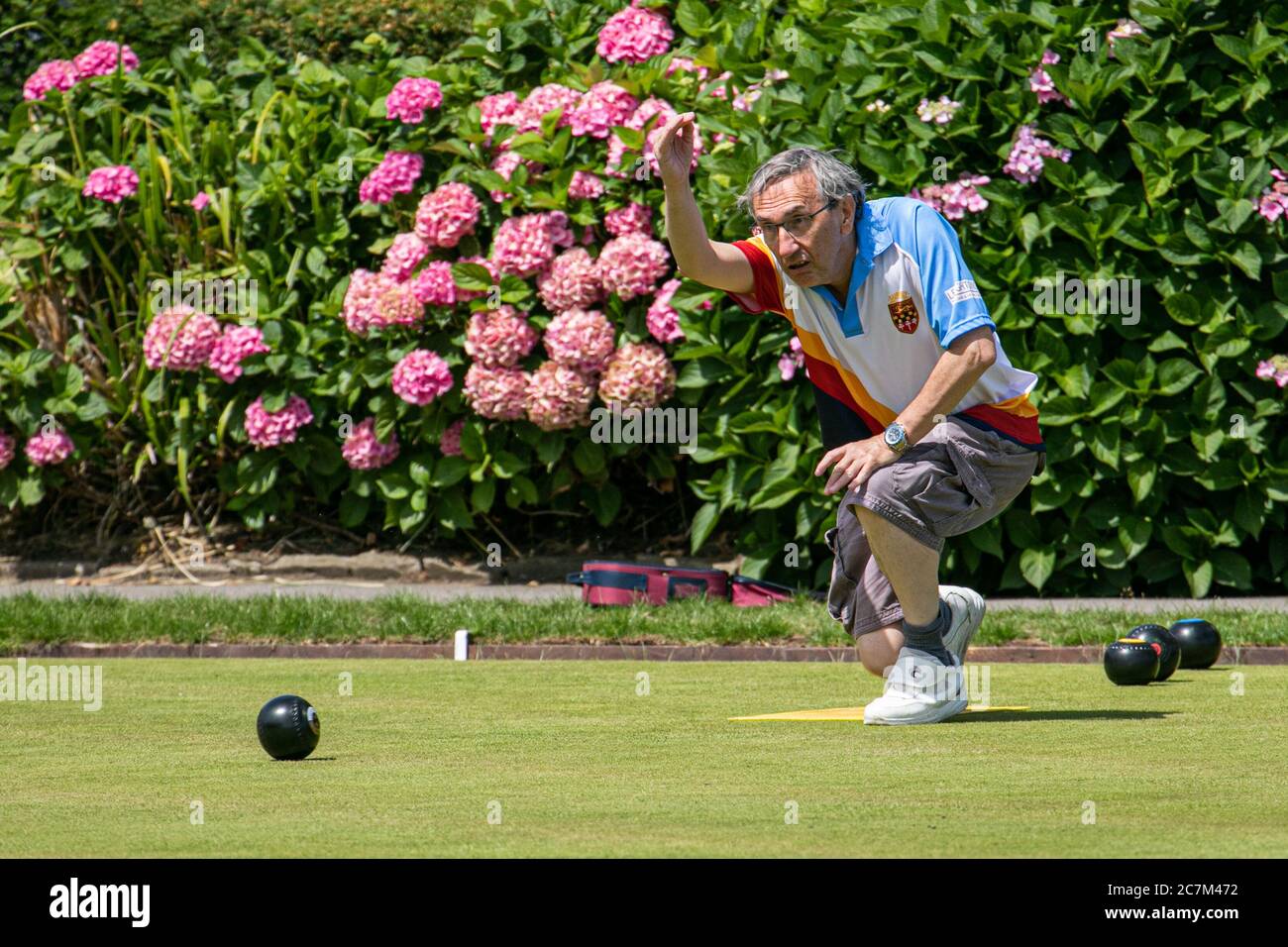 WIMBLEDON LONDON UK. 18th July, 2020. Members of the Wimbledon Park Bowls Club enjoy bowling outdoors on a hot summer day as lockdown restrictions are lifted and sport facilities reopen Credit: amer ghazzal/Alamy Live News Stock Photo