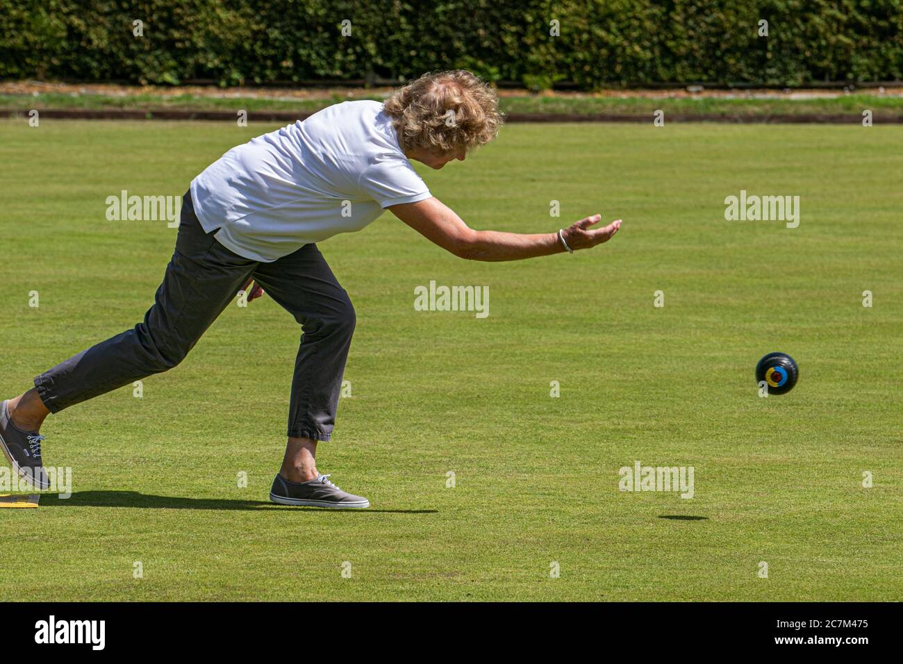 WIMBLEDON LONDON UK. 18th July, 2020. Members of the Wimbledon Park Bowls Club enjoy bowling outdoors on a hot summer day as lockdown restrictions are lifted and sport facilities reopen.Credit: amer ghazzal/Alamy Live News Stock Photo