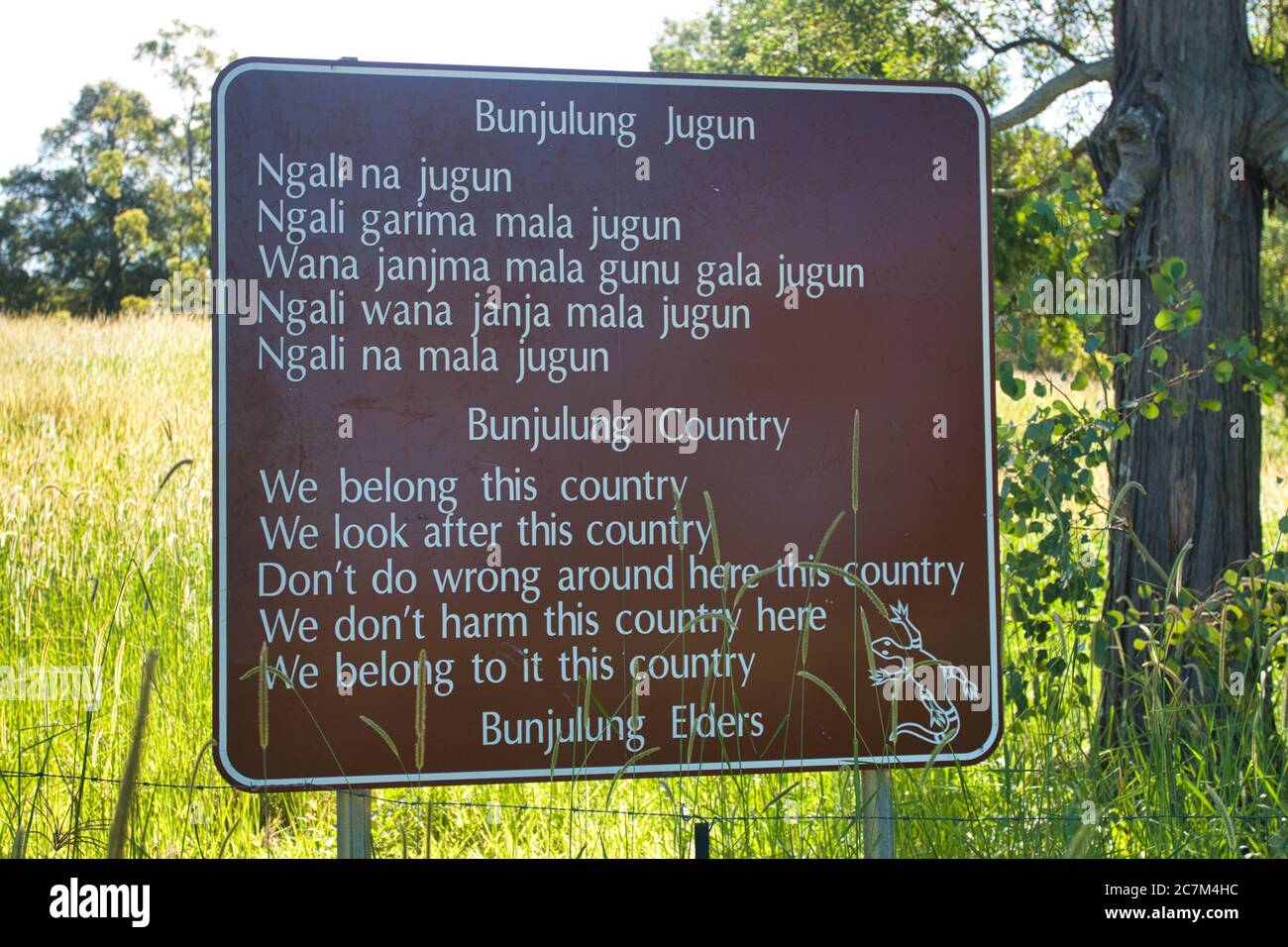 A sign in the country in both english and aboriginal languages to say the aboriginals belong to the land, in central eastern NSW., Australia Stock Photo