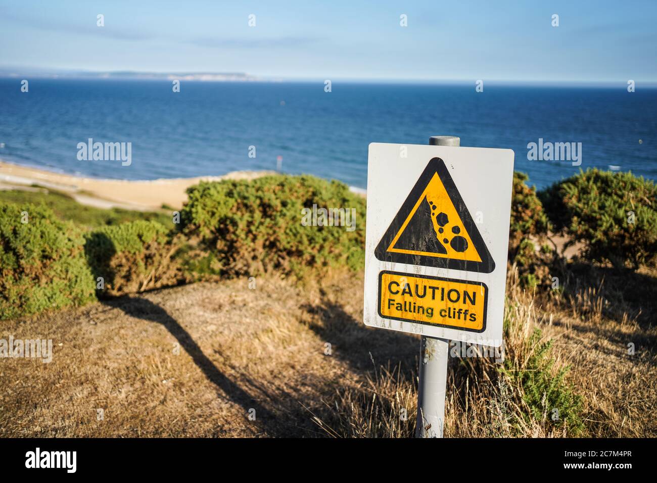 Rock-coast seaweed warning-sign sea-gaze coast rocks stones sign sign  warning respect caution hint sea surf cloud-heavens Stock Photo - Alamy