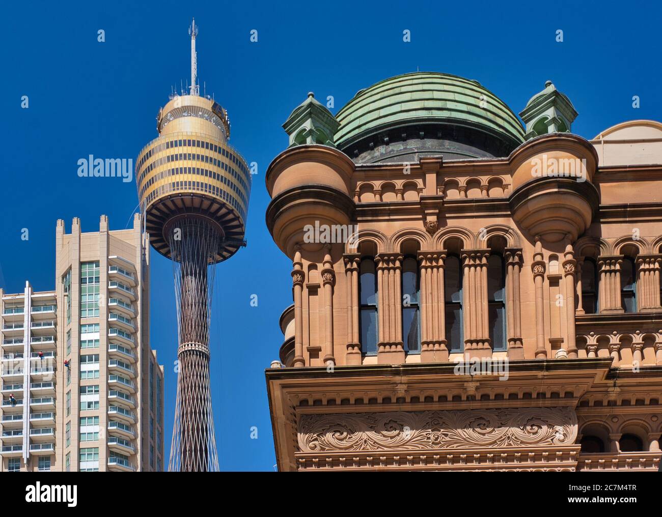 Architecture old and new - the Queen Victoria Building at left with modern Sydney Tower in the background, Sydney, NSW., Australia. Stock Photo