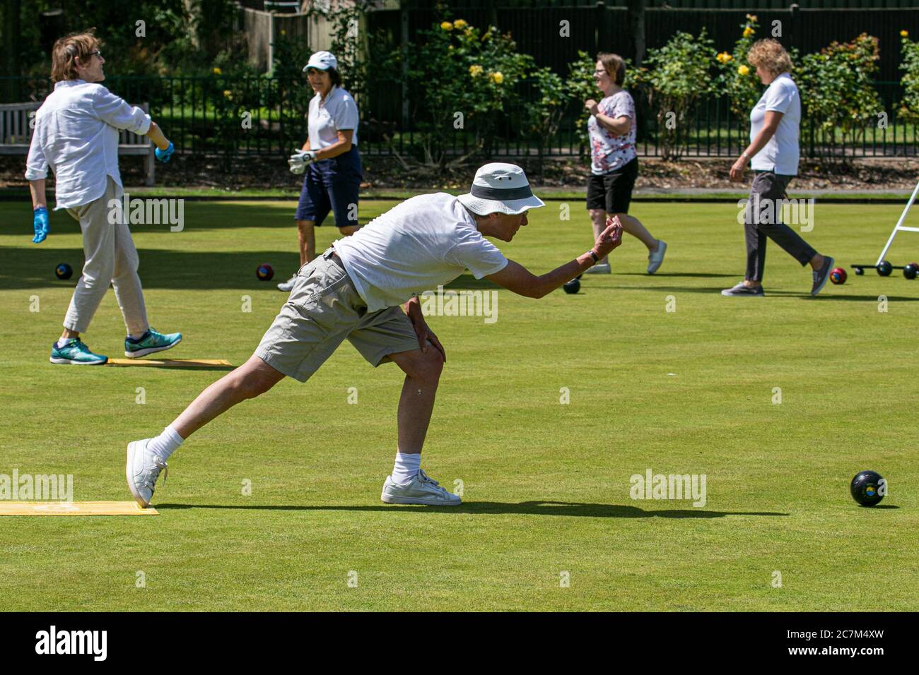 WIMBLEDON LONDON UK. 18th July, 2020. Lawn bowlers from the Wimbledon Park Bowls Club enjoy bowling outdoors on a hot summer day as lockdown restrictions are lifted and sport facilities reopen.Credit: amer ghazzal/Alamy Live News Stock Photo