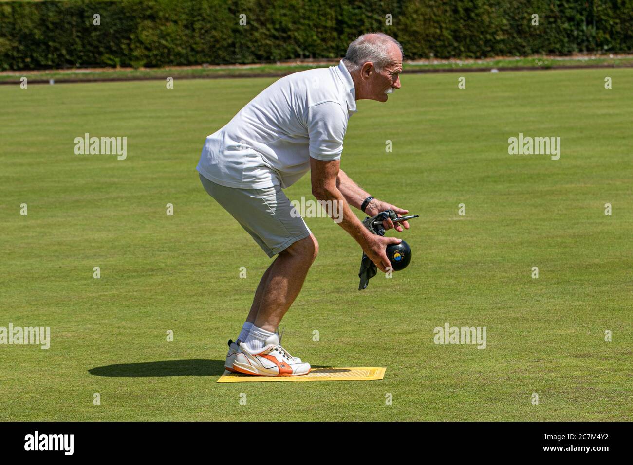 WIMBLEDON LONDON UK. 18th July, 2020. Lawn bowlers from the Wimbledon Park Bowls Club enjoy bowling outdoors on a hot summer day as lockdown restrictions are lifted and sport facilities reopen.Credit: amer ghazzal/Alamy Live News Stock Photo