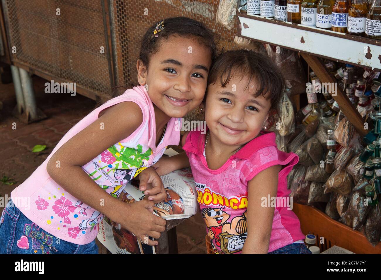 Two charming little girls pose for the camera in the market in Belem, Para state, Brazil Stock Photo