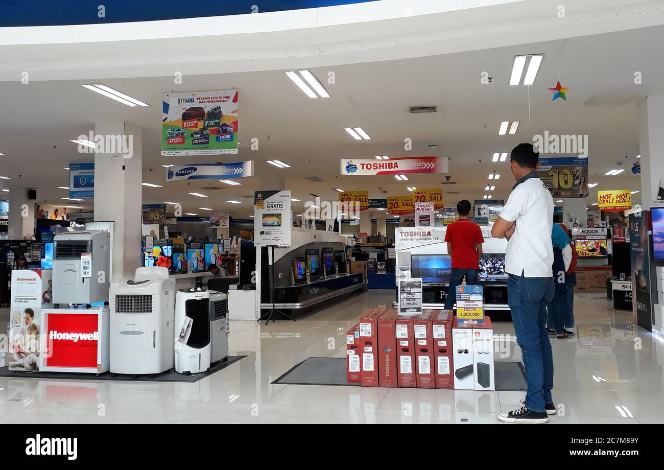 Depok, Indonesia - January 1, 2019: Visitors see electronic items in the store in Margo City Mall. Stock Photo