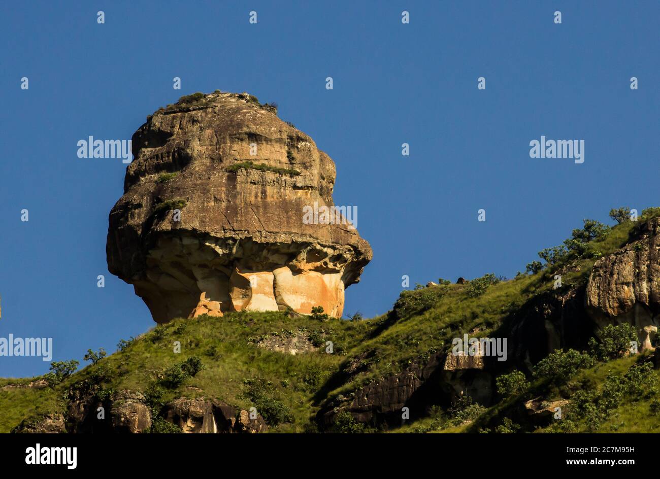 A wind  eroded Clarence sandstone formation known as the Policeman’s Helmet in Royal Natal, the Northern part of the Drakensberg world Heritage Site i Stock Photo