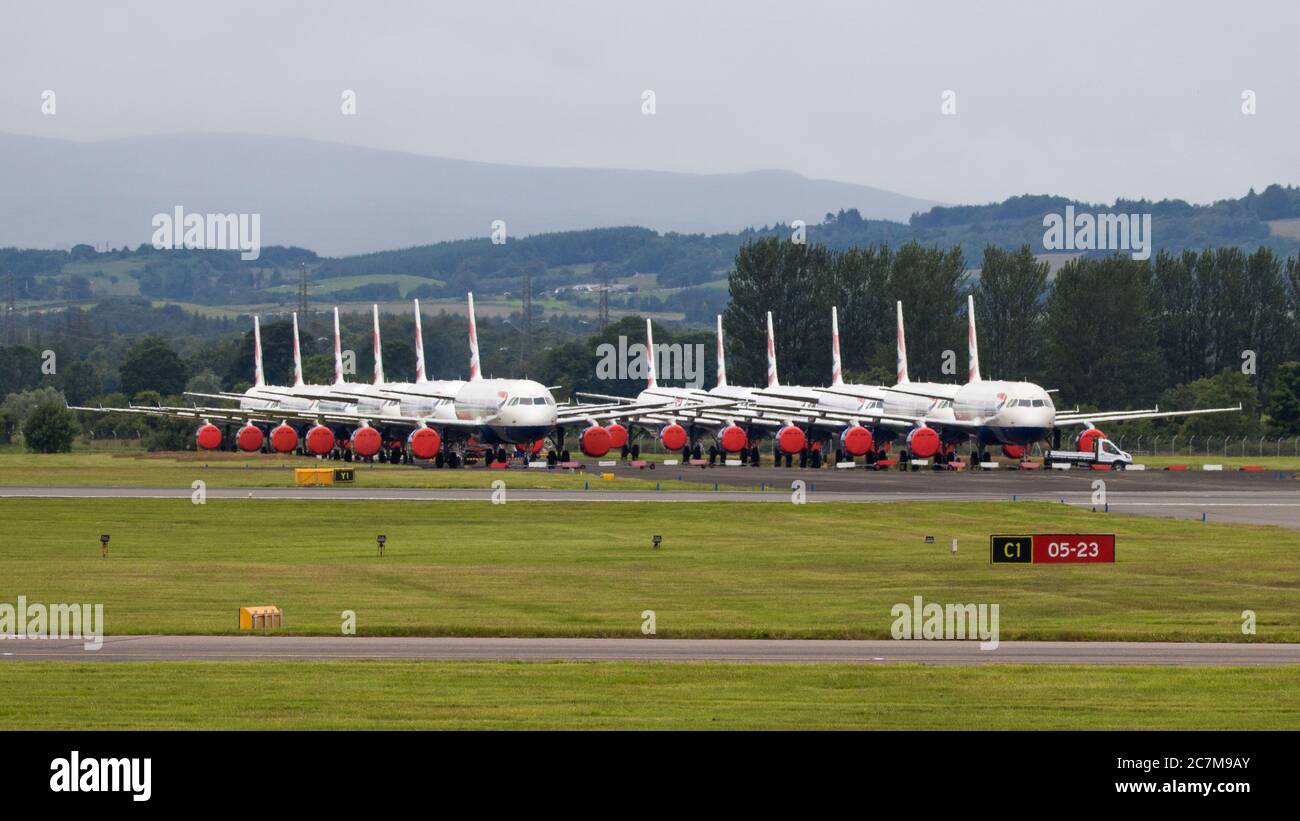 Glasgow, Scotland, UK. 17 July 2020. Pictured:  Grounded British Airways Airbus A319/A320/A321 aircraft form the backdrop showing how bad the coronavirus (COVID19) crisis has affected the global airline industry.  British Airways today axed all of its Boeing 747 services cutting back and have already axed a quarter of its staff due to the pandemic. Credit: Colin Fisher/Alamy Live News. Stock Photo
