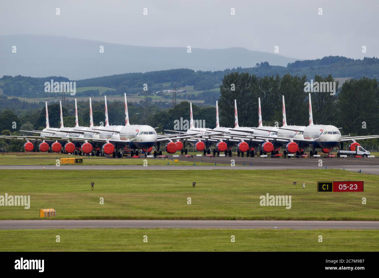 Glasgow, Scotland, UK. 17 July 2020. Pictured:  Grounded British Airways Airbus A319/A320/A321 aircraft form the backdrop showing how bad the coronavirus (COVID19) crisis has affected the global airline industry.  British Airways today axed all of its Boeing 747 services cutting back and have already axed a quarter of its staff due to the pandemic. Credit: Colin Fisher/Alamy Live News. Stock Photo