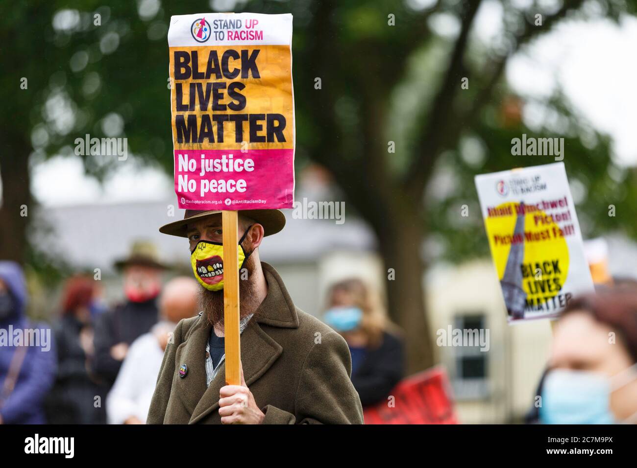 Carmarthen, Carmarthenshire, Wales, UK. 18 July, 2020. Protesters march in support of the removal of the Picton Monument in Carmarthen that commemorates General Thomas Picton, former Governor of Trinidad.  Credit: Gruffydd Ll. Thomas/Alamy Live News Stock Photo