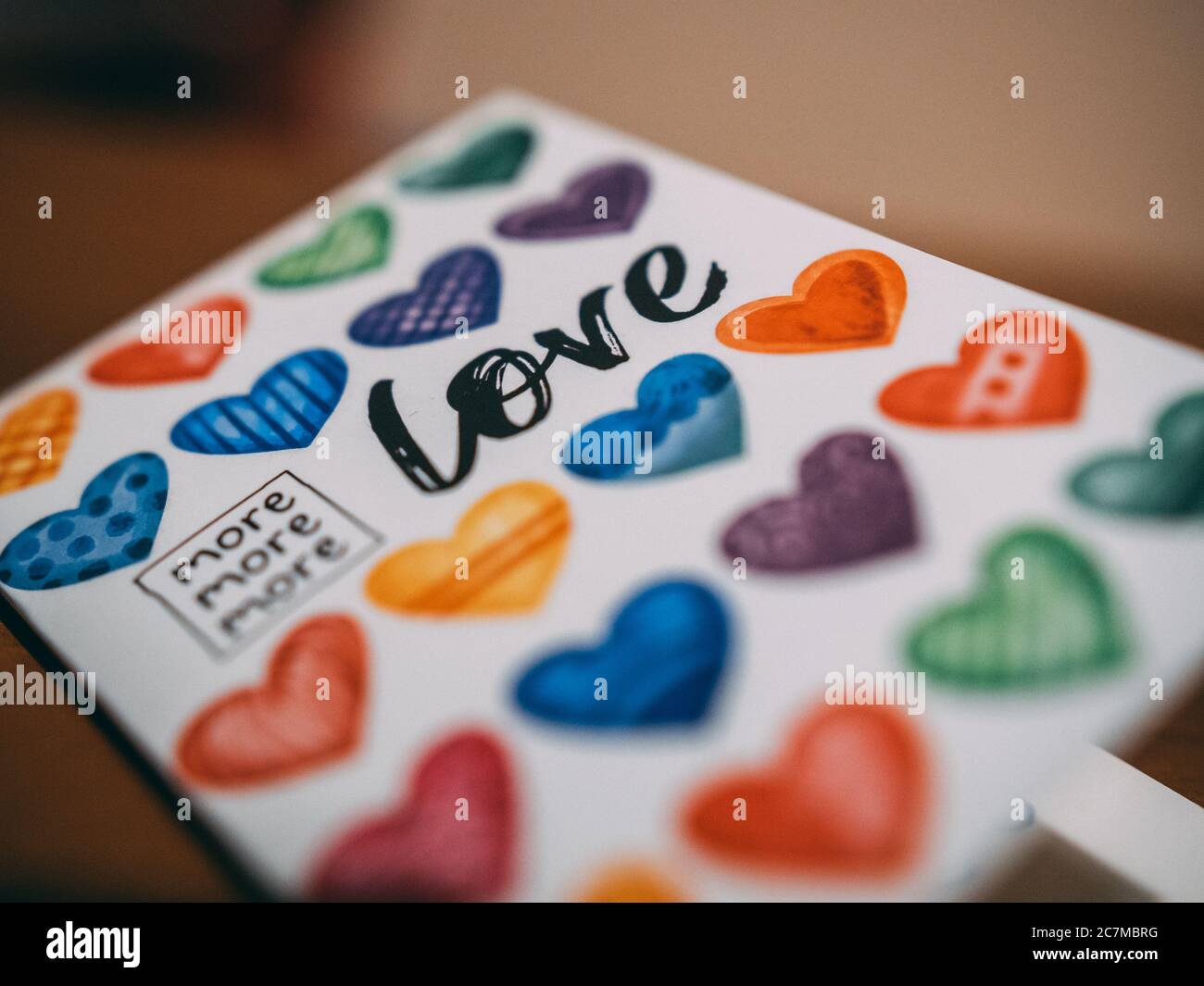 Colorful copybook with hearts and love written on it Stock Photo