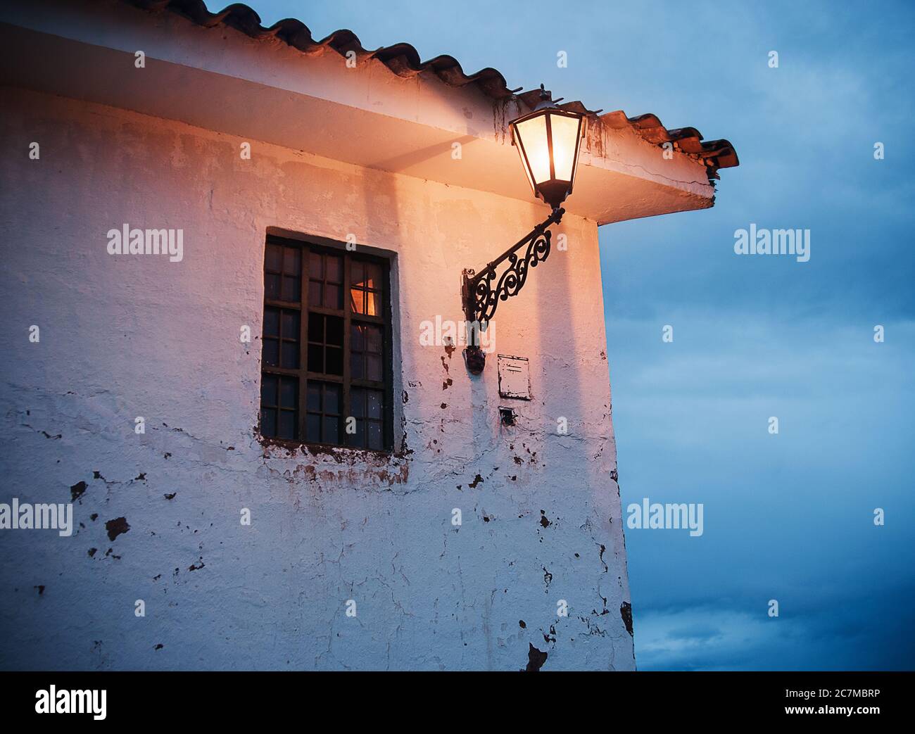 Old lampost on a building in Chinchero Peru, South America Stock Photo