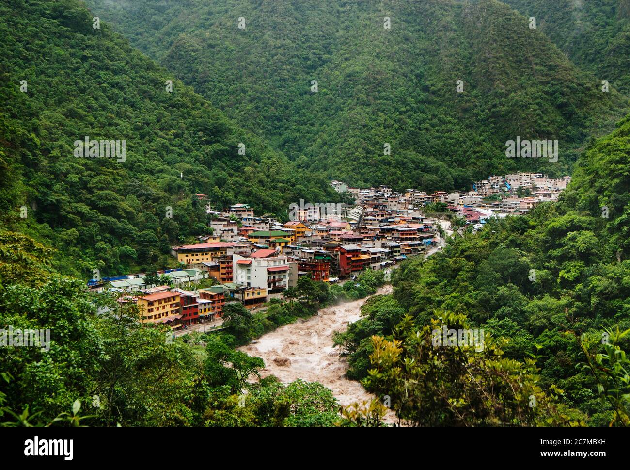 The green Andes mountains surrounding the town of Aguas Calientes, Cusco, Peru, South America Stock Photo