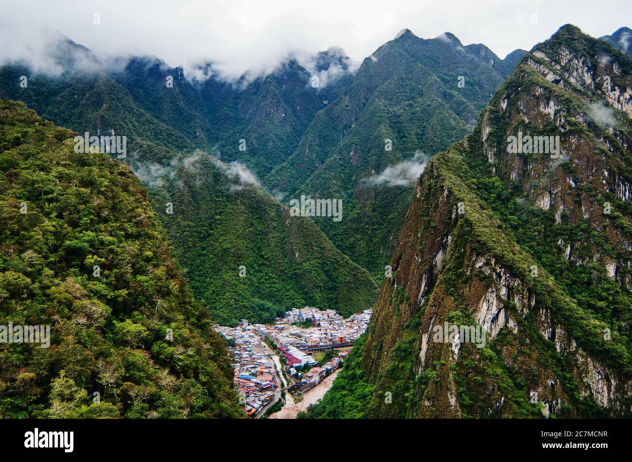 The green Andes mountains surrounding the town of Aguas Calientes, Cusco, Peru, South America Stock Photo