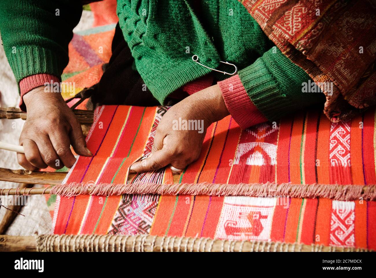 Womans hands weaving, Chaullacocha village, Andes Mountains, Peru