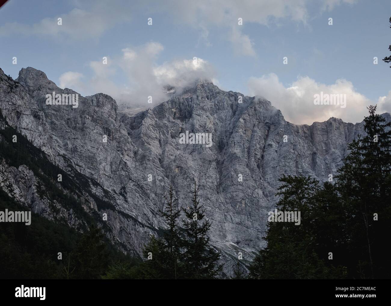 Beautiful shot of a rocky mountain under the cloudy sky Stock Photo - Alamy