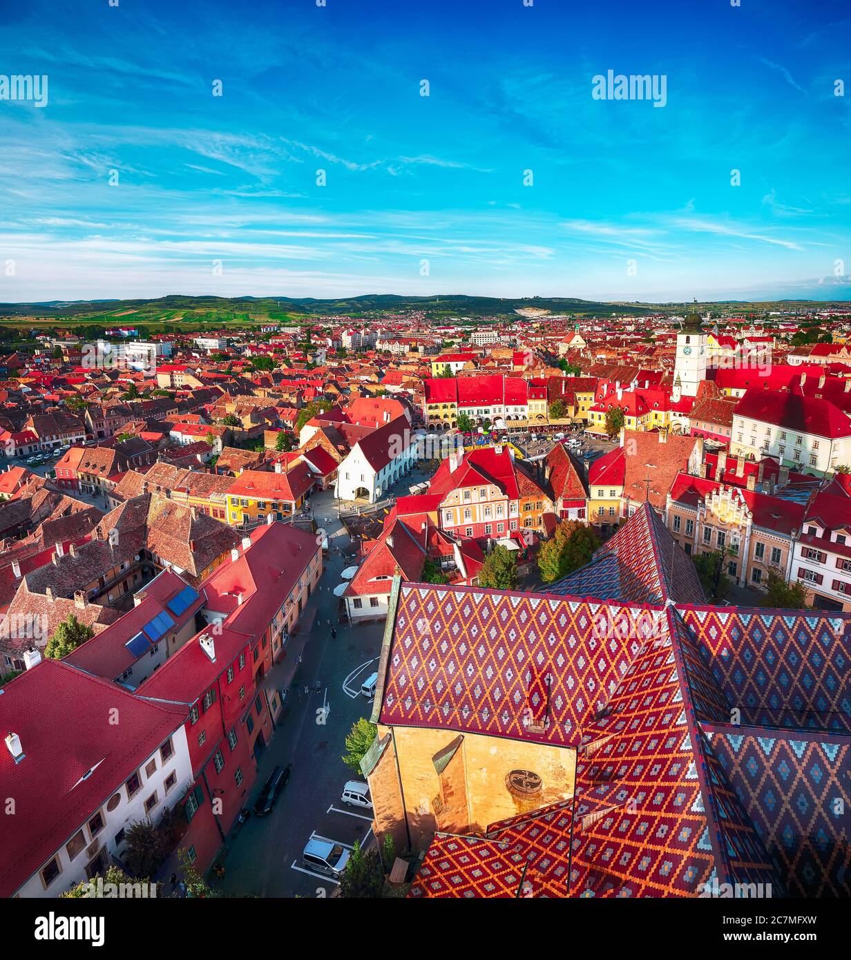 View from bell tower of St Mary Cathedral on the Old Town in Sibiu city. Aerial cityscape of Sibiu town. Impressive morning scene of Transylvania, Rom Stock Photo