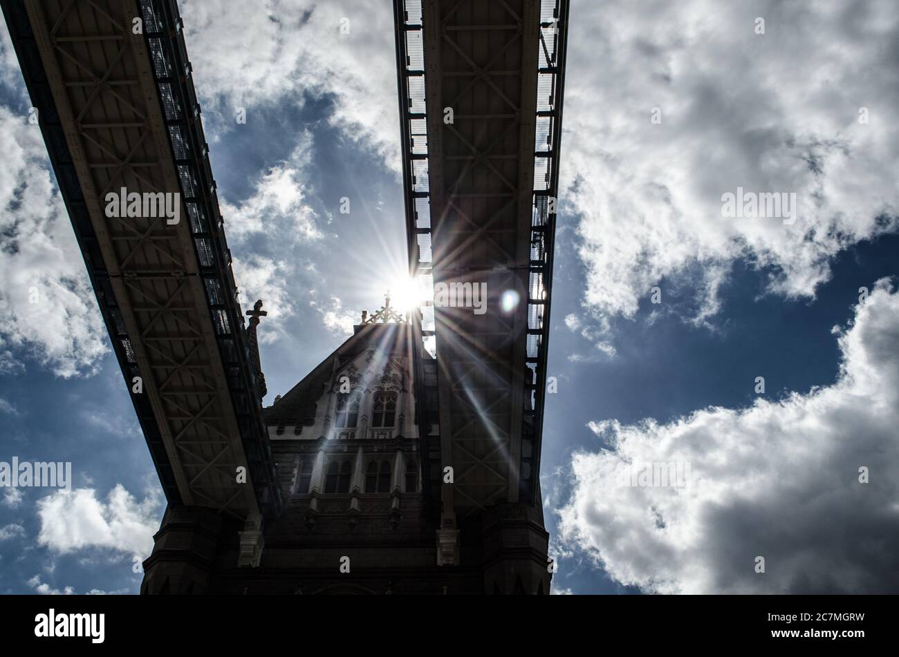 Sun between London Bridge Stock Photo