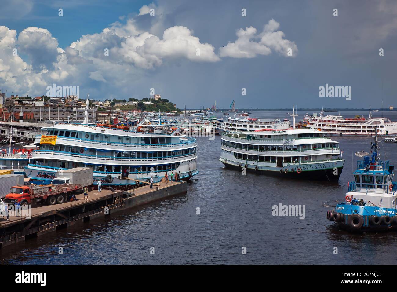 Typical Brazilian style ferry boats manoeuvre at the dockside of Manaus on the River Amazon, Amazonas State, Brazil Stock Photo