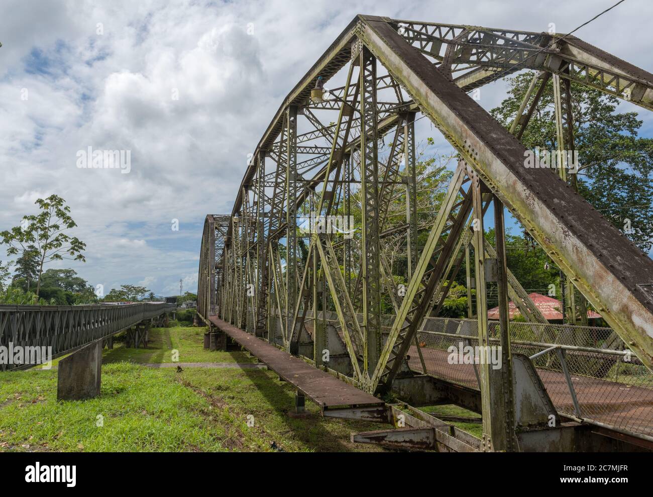 Old railway and border bridge across the Sixaola River between Costa Rica and Panama Stock Photo