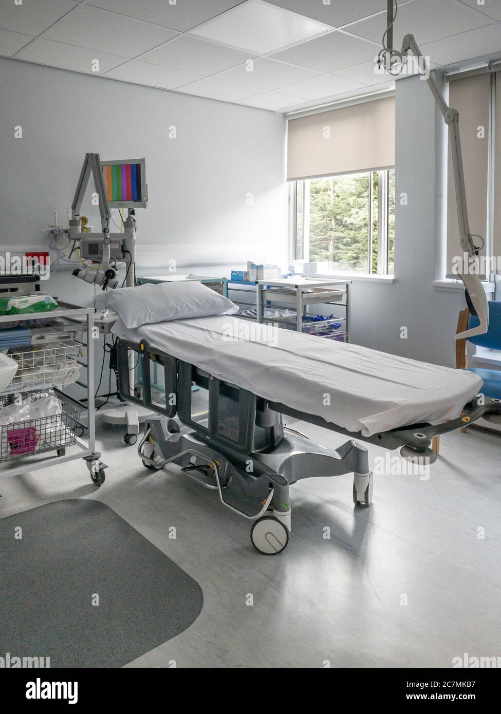 Stretcher in assessment and treatment room of hospital Stock Photo