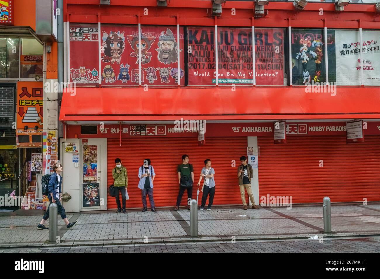 Tokyo, Japan - June 23, 2018: Young male gamers in line waiting to enter video game contests in the Akihabara district of Tokyo. Stock Photo