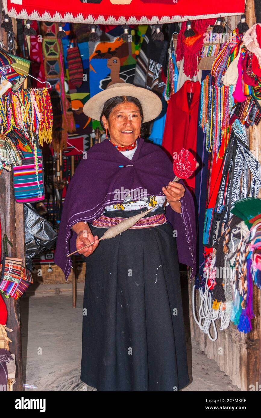 Ecuadorian woman in native costume at equator museum near Quito. Stock Photo