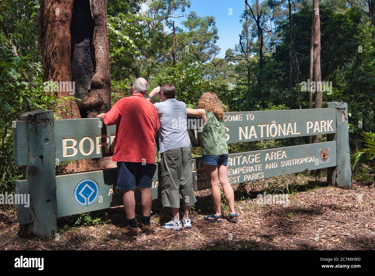 People at the Border Ranges sign in the mid east of New South Wales, Australia Stock Photo