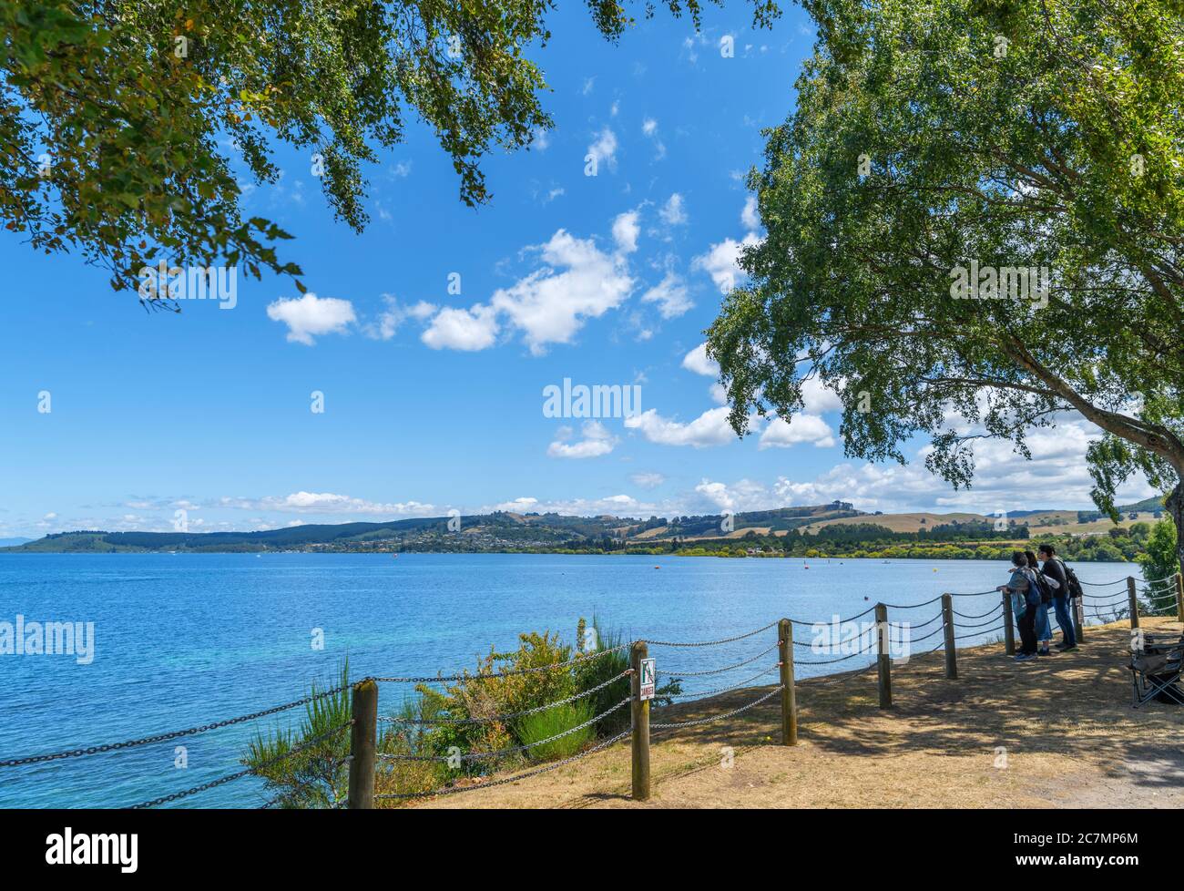 Tourists on the lakefront in Taupo, Lake Taupo, New Zealand Stock Photo