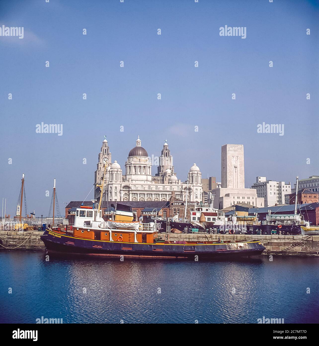 Liverpool. This is Liverpool docks looking across towards  the Royal Liver buildings with clock face and ventilation tower from the River Mersey tunnel Stock Photo